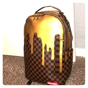 sprayground gold drip backpack